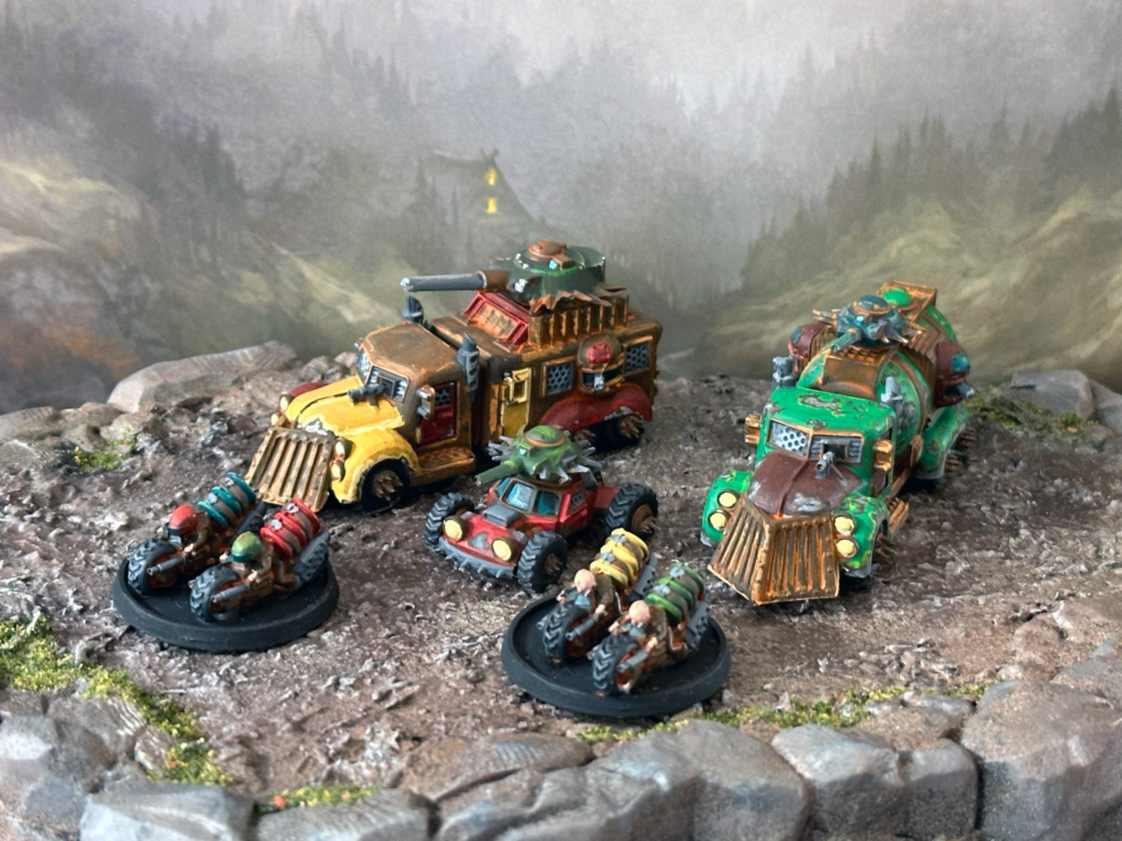 A group shot of the 50pt starter set, showing the murderbus, pulverizer, killcar and two sets of bikers