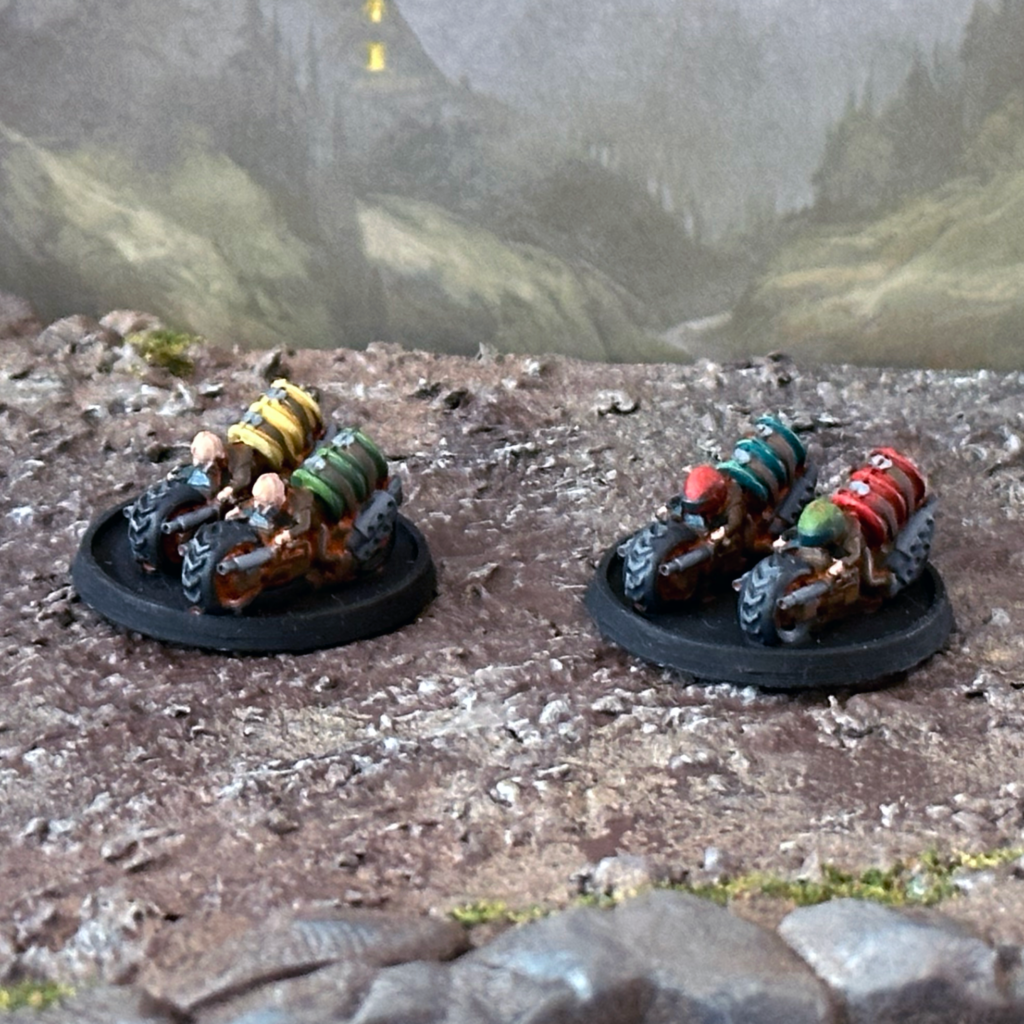 Two bases of Reave Pillager Bikes: heavy duty motorbikes ridden by humans with guns on the front, with a large fuel tank on the rear.